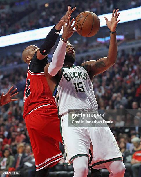 Taj Gibson of the Chicago Bulls blocks a shot by Greg Monroe of the Milwaukee Bucks at the United Center on March 7, 2016 in Chicago, Illinois. NOTE...