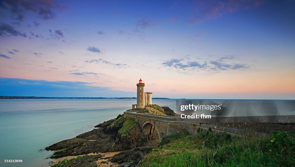 Amazing sunrise at lighthouse Phare du Petit Minou in the Finistere, Brittany, France