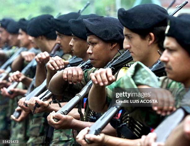 Soldiers of the Revolutionary Armed Forces of Colombia , take part in a military parade in San Vicente del Caguan, Caqueta, Colombia, 07 February...