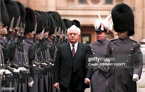 Eduard Shevardnadze, head of state for the Georgian Republic, inspects a guard of honor of the 1st Battalion of Irish Guards 15 February, upon...