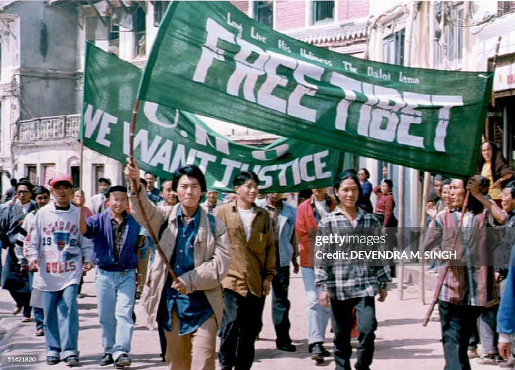 A group of Tibetan youths hold a demonstration den