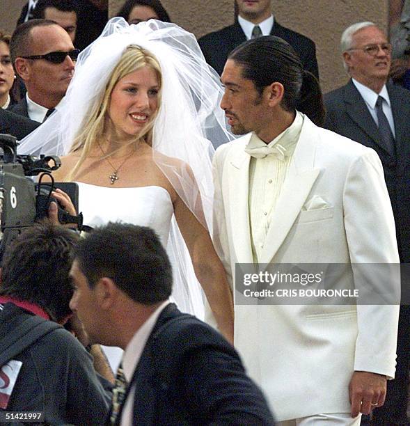 Chilean tennis star Marcelo Rios and his 17-year-old bride Giuliana Sotela leave the Santa Ursula church in Santiago, Chile after their wedding...