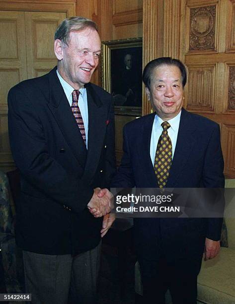 Canadian Prime Minister Jean Chretien shakes hand with People's Republic of China Vice Premier Qian Qichen, 19 September, prior to a meeting at...