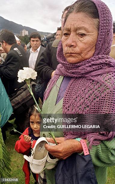 Josefina Tipantuna is the grandmother of Galo Palacios who emigrated to Spain six months ago, she is holding a white flower in Quito, Ecuador, 19...