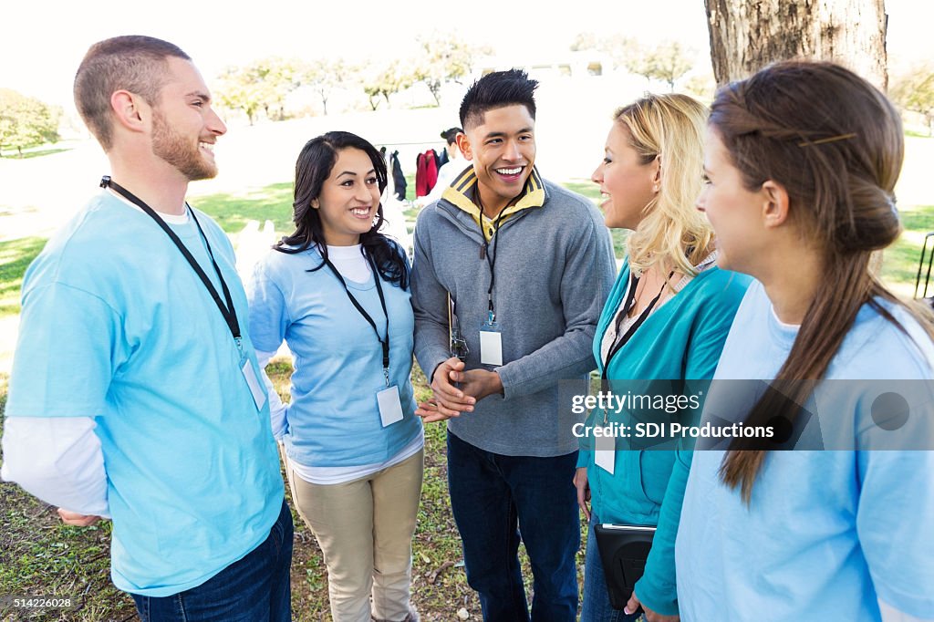 Group of volunteers at clothing drive in park