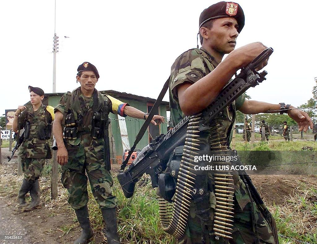 Farc Revolutionary Armed Forces of Colombia guerrillas guard the location ...