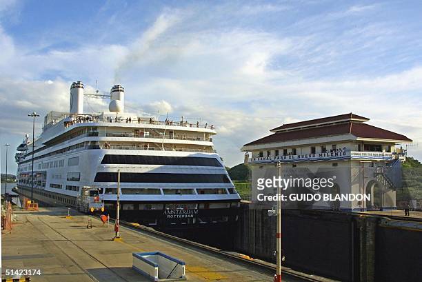 The cruise ship "Amsterdam" passes through the Miraflores locks of the Panama Canal 10 January 2002. AFP PHOTO/Guido BLANDON