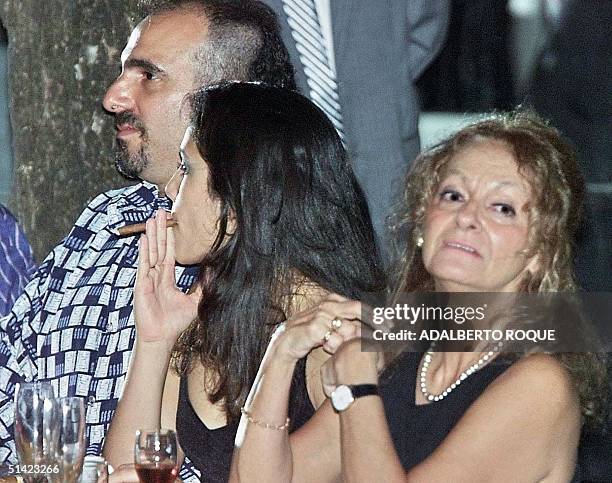 Fidel Castro's son Alejandro Castro Soto del Valle , during a dinner party at the Cigar Festival in Havana. At right are his mother, Dalia Soto del...