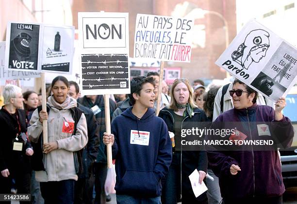 Demonstrators gather outside the French consulate 04 May, 2002 in Montreal to protest French far right National Front leader Jean-Marie Le Pen's...
