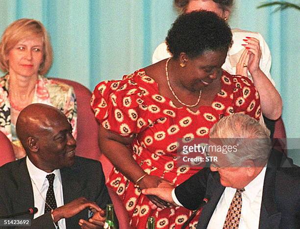 Gertrude Mongella, the secretary general for the Fourth World Conference on Women, is congratulated by Ismat Kittani, a representative from the UN 15...
