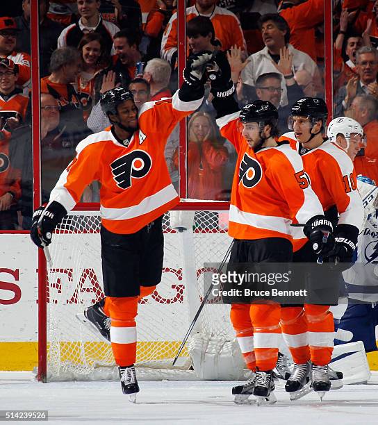 Wayne Simmonds and Shayne Gostisbehere of the Philadelphia Flyers celebrate Gostisbethere's third period goal against the Tampa Bay Lightning at the...