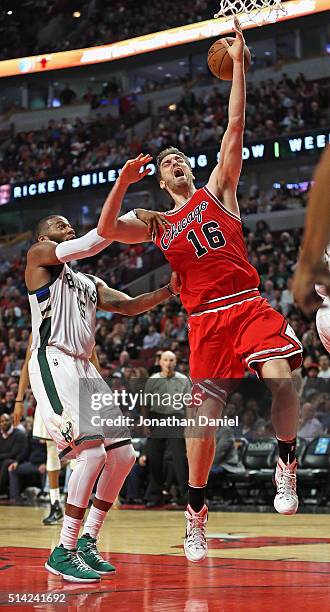 Greg Monroe of the Milwaukee Bucks fouls Pau Gasol of the Chicago Bulls at the United Center on March 7, 2016 in Chicago, Illinois. The Bulls...