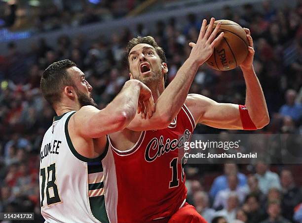 Pau Gasol of the Chicago Bulls goes up for a shot against Miles Plumlee of the Milwaukee Bucks on his way to a triple-double at the United Center on...