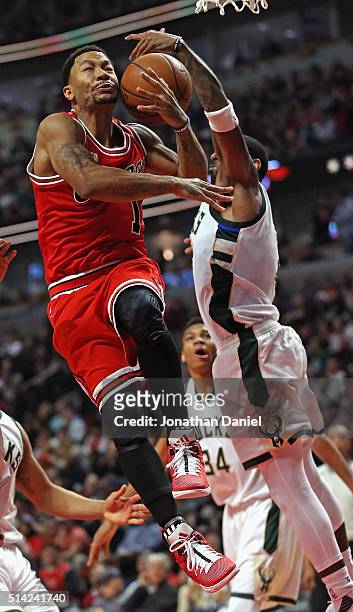 Mayo of the Milwaukee Bucks blocks a shot by Derrick Rose of the Chicago Bulls at the United Center on March 7, 2016 in Chicago, Illinois. The Bulls...
