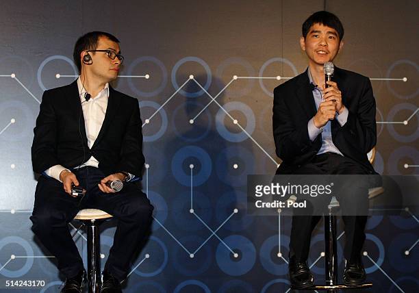 Demis Hassabis, CEO of Google's artificial intelligence startup DeepMind and South Korean professional Go player Lee Se-dol attend the press...