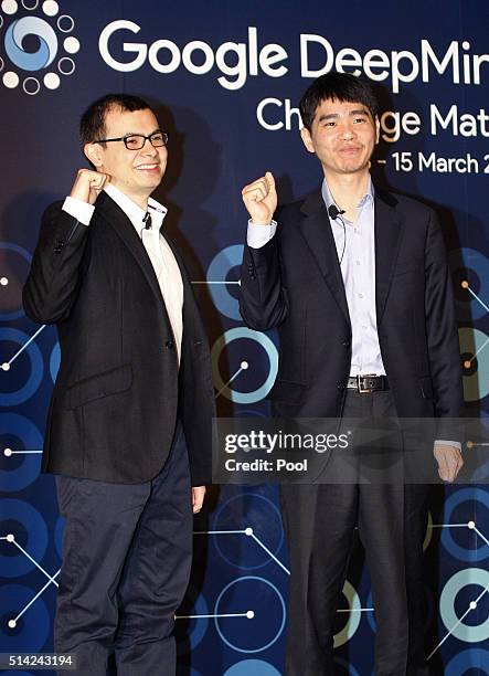 Demis Hassabis, CEO of Google's artificial intelligence startup DeepMind and South Korean professional Go player Lee Se-dol attend the press...