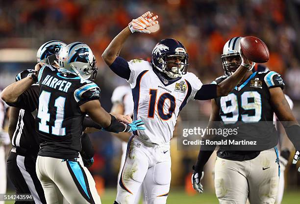 Emmanuel Sanders of the Denver Broncos reacts as Roman Harper and Kawann Short of the Carolina Panthers look on during Super Bowl 50 at Levi's...