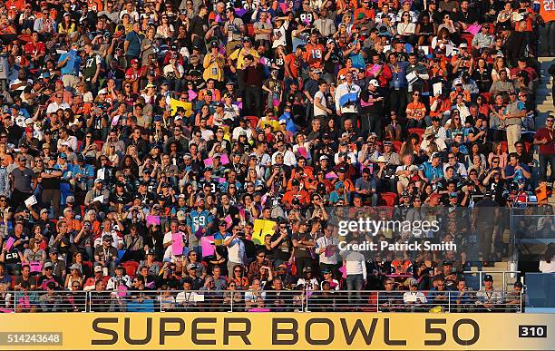 Fans watch play between the Carolina Panthers and the Denver Broncos during the Pepsi Super Bowl 50 Halftime Show at Levi's Stadium on February 7,...