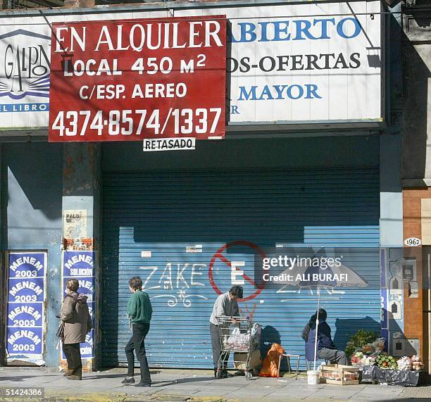 As a result of the economic crisis, many businesses in Buenos Aires have closed their shops and empty spaces are being offered for sale or rent, 22...