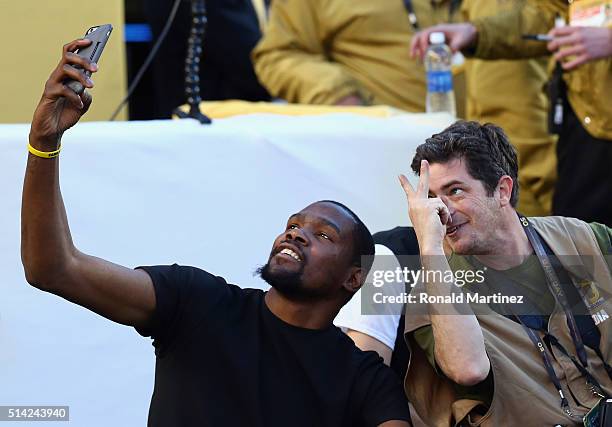 Kevin Durant of the Oklahoma City Thunder takes a selfie with photographer Jed Jacobsohn during Super Bowl 50 at Levi's Stadium on February 7, 2016...