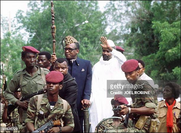 Mobutu Sese Seko, president of Zaire , and Hissene HabrT, president of Chad, wave to wellwishers, 20 August 1983, upon Mobutu's arrival to N'djamena.