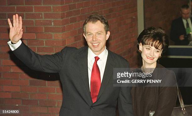 Labour leader Tony Blair and wife Cherie wave after on their arrival at the Sedgefield constituency, 02 May, after six weeks of compaigning...