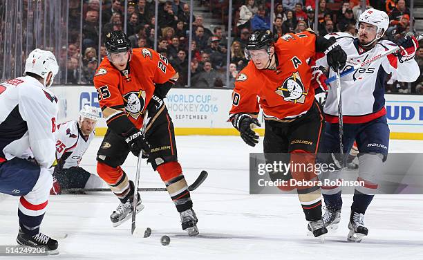 Mike Santorelli of the Anaheim Ducks brings the puck up the ice as Mike Weber of the Washington Capitals defends on March 7, 2016 at Honda Center in...