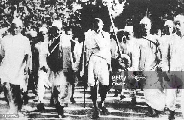 Indian freedom fighter Mohandas Karamchand Gandhi is pictured with his followers in this March, 1930 photo during the famous salt march to Dandi,...