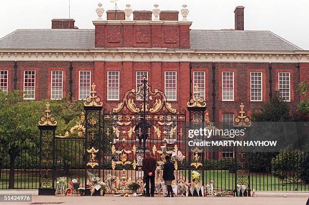 Crowds continue to place flowers outside Kensington Palace the home of the Princess of Wales 31 August after it was announced that she had died early...