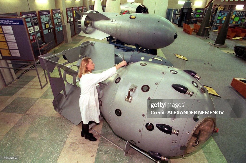 A nuclear museum staffer cleans, 19 October the fi