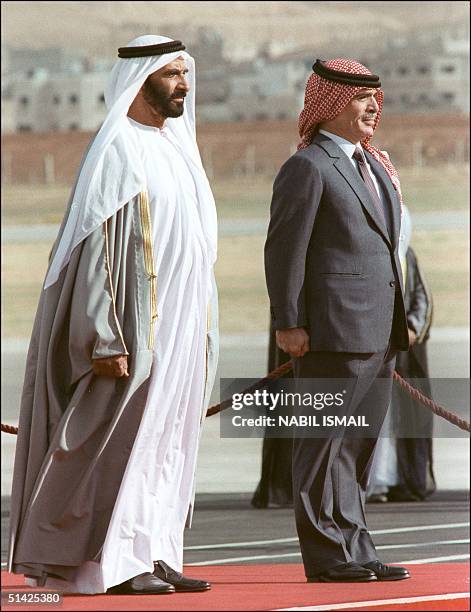 Hussein Ibn Talal, King of Jordan and President Sheikh Zayed bin Sultan al-Nahyan of the United Arab Emirates , listen to national anthems at Marka...