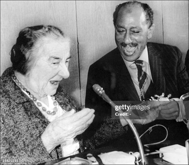 File picture dated 21 November 1977 of Israel former Prime Minister Golda Meir exchanging present with Egyptian President Anwar EL Sadat during a...