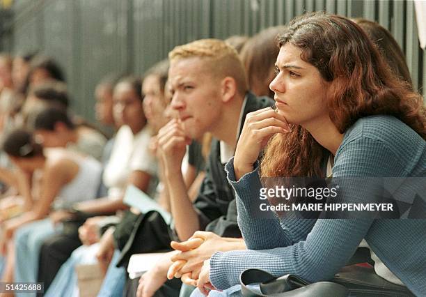 Dozens of young people looking for jobs line up for openings at a restaurant 31 January, 2000 in Sao Paulo. The Sao Paulo region recorded a record...