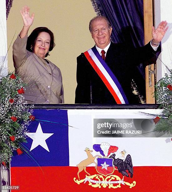 Ricardo Lagos, new president of Chile, is joined byhis wife, Luisa Duran, and they greet the crowd from a balcony at the Presidential Palace in...