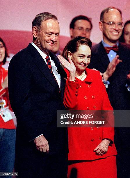 Canadian Prime Minister Jean Chretien and his wife Aline Chretien wave to the crowd of supporters during the closing ceremony of the Liberal...