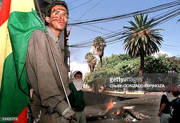 Demonstrators protest a proposed hike in water rates 10 April 2000 in Cochabamba, Bolivia. An end to a week of violent protests in Bolivia appeared...