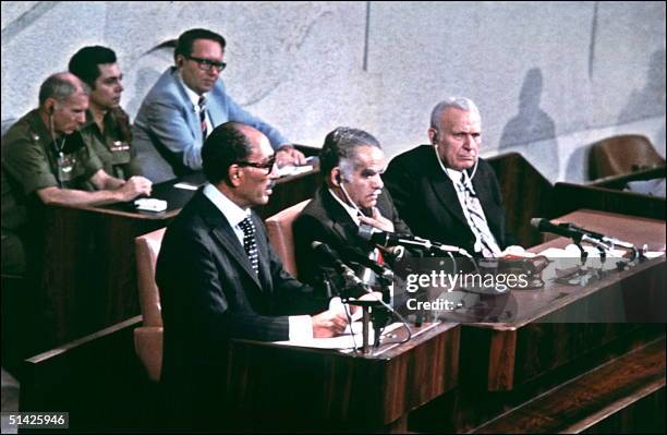 Egyptian President Anwar al-Sadat addresses 20 November 1977 in Jerusalem the Knesset during his historic visit to Israel as Israeli Premier Yitzhak...