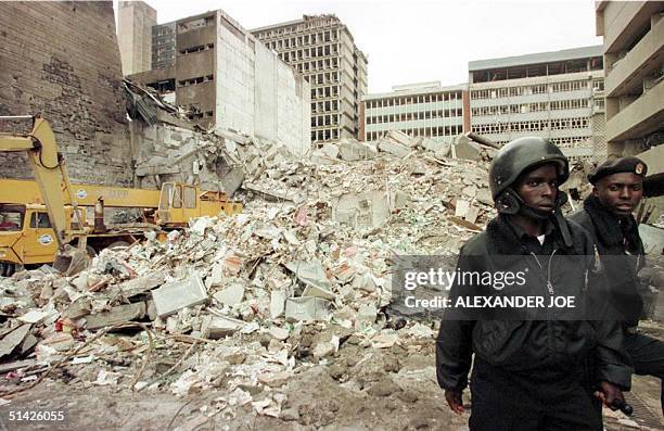 Kenyan security guards keep watch 08 August over the scene of yesterdays bomb explosion near the US embassy in Nairobi. The latest toll from the...