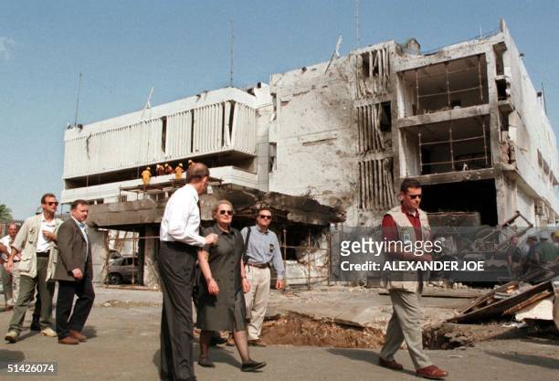 Secretary of State Madeleine Albright looks 18 August at damage from a bomb at the US embassy in Dar Es Salaam, Tanzania where 10 people were killed...