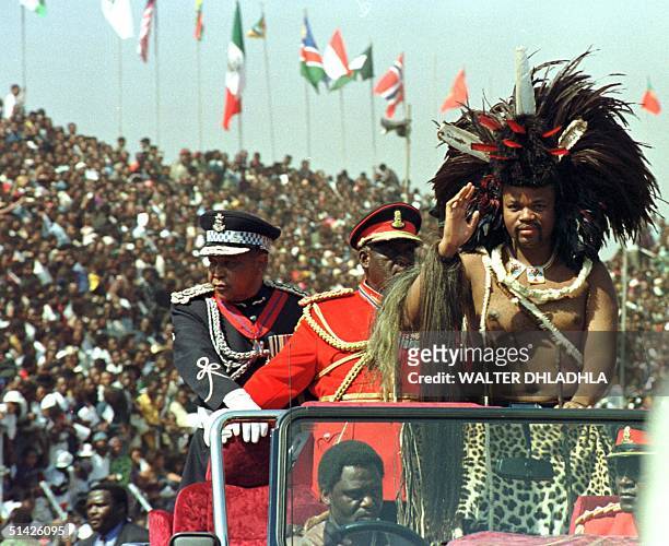 Swaziland King Mswati III salute the crowd upon arrival for the celebration of his 30th birthday which coincides with the 30th anniversary of Swazi...