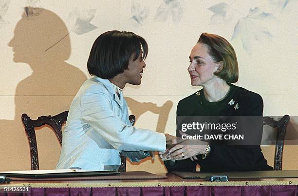 Aline Chretien , wife of Canadian Prime Minister Jean Chretien, bids farewell to Haitian First Lady Geri Benoit-Preval at the closing ceremony of the...