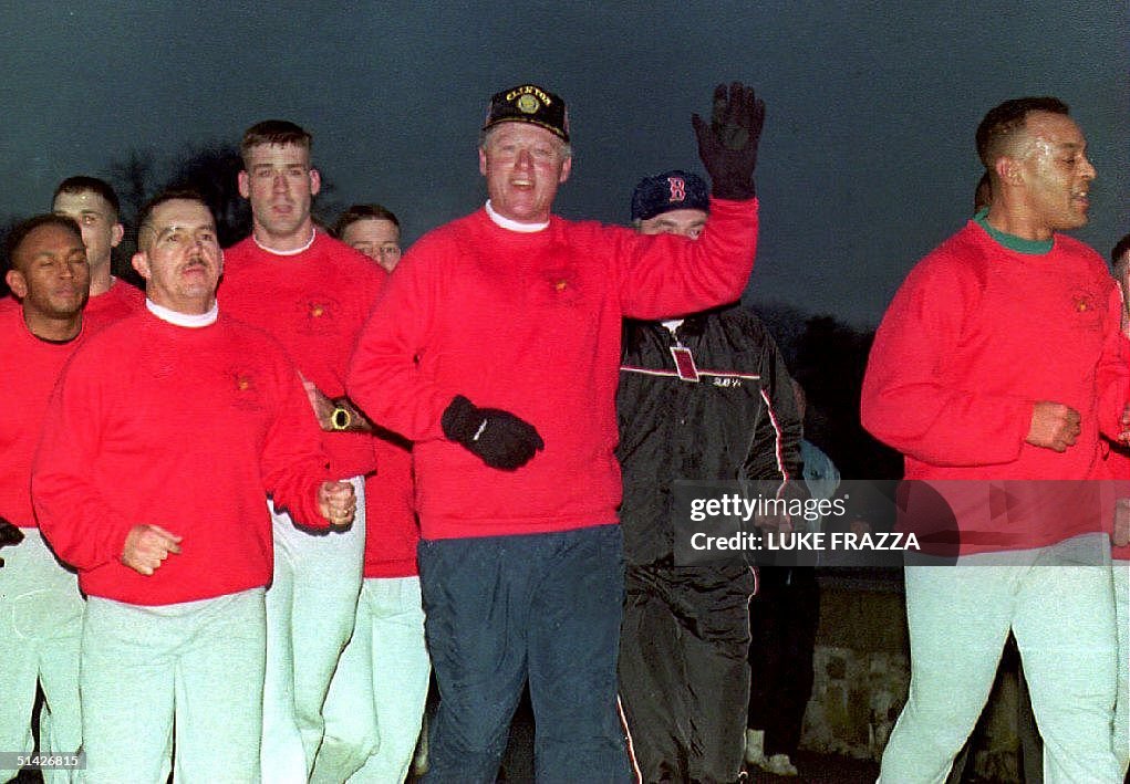 U.S. President Bill Clinton waves during an early