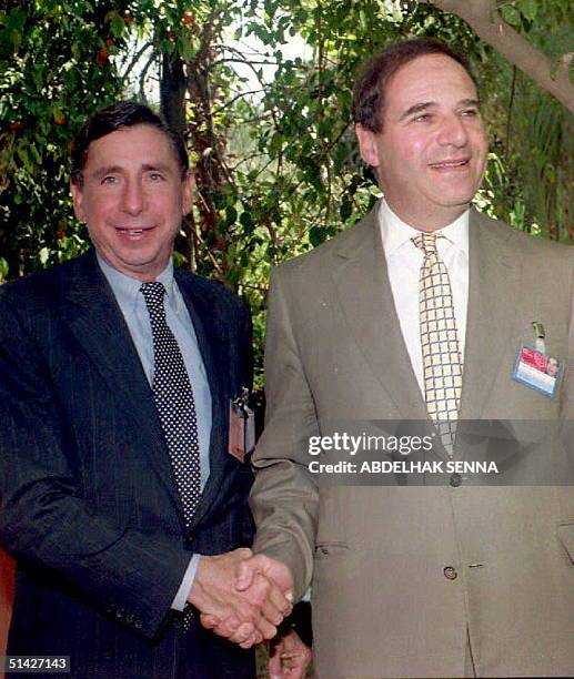 European Commission spokesman Sir Leon Brittan shakes hands with US Trade Representative Mickey Kantor, prior to a bilateral meeting 12 April 1994 in...