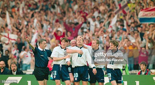 England players Darren Anderton Paul Gascoigne celebrate with goalscorer Teddy Sheringham and Alan Shearer and Steve McManaman after he had scored...