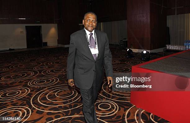 Billionaire Aliko Dangote, president and chief executive officer of Dangote Group, arrives at The Economist Nigeria Summit, in Lagos, Nigeria, on...