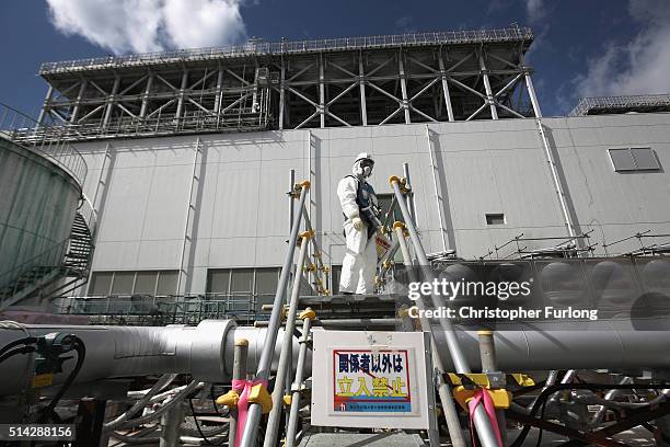 Employees work on the construction of the 'Ice Wall' which will use coolants to create a 30 metre deep wall of ice to prevent groundwater from...