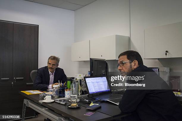Carmelo Haddad, left, and Francisco Ghersi, managing directors of Knossos Asset Management, listen during an nterview in the company's offices in...