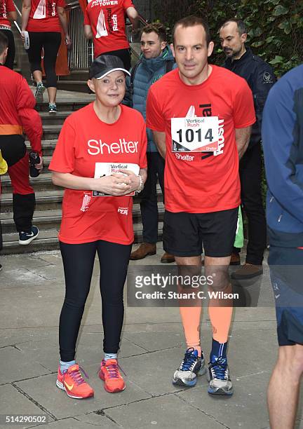 Gail Porter and Martin Lewis take part in the Shelter Vertical Rush at Tower 42 on March 8, 2016 in London, England.