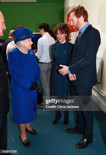 Queen Elizabeth II meets actor and actress husband and wife Helen McCrory and Damien Lewis at the Prince's Trust at the Prince's Trust Centre in...