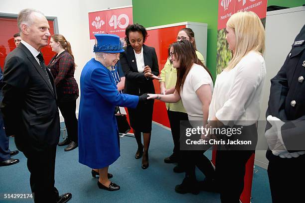 Queen Elizabeth II meets 'success stories' helped by the Prince's Trust at the Prince's Trust Centre in Kennington on March 8, 2016 in London,...